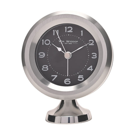 Round mantel alarm clock on a pedestal foot, with a silver casing, black dial, white Arabic numerals, and silver hands, shown on a plain white background.