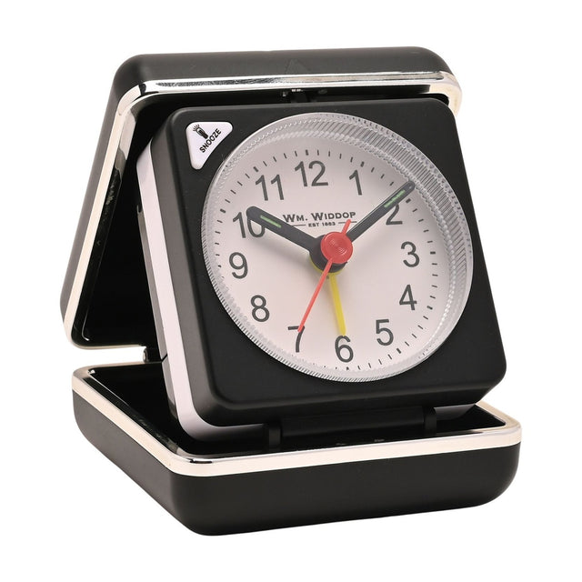 Mini square alarm clock in black folding case with silver trim, white dial, black numerals, black hands, red seconds hand and yellow alarm hand, shown open on a plain white background.