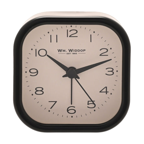Rounded square metal alarm clock with black case and cream dial, bold black Arabic numerals, black hour, minute and alarm hands, on a plain white background.