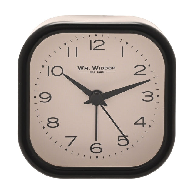Rounded square metal alarm clock with black case and cream dial, bold black Arabic numerals, black hour, minute and alarm hands, on a plain white background.