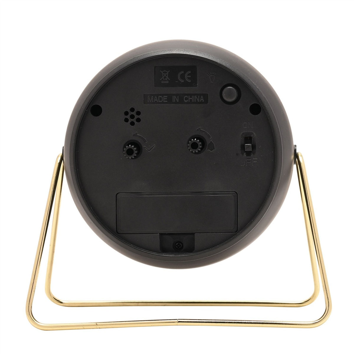 Rear view of the Medium Kent Metal Alarm Clock in black, showing the battery compartment, time-set dials, on/off switch, and gold wire stand, on a plain white background.