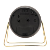 Rear view of the Medium Kent Metal Alarm Clock in black, showing the battery compartment, time-set dials, on/off switch, and gold wire stand, on a plain white background.