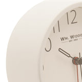 Close-up of the Round Analogue Metal Alarm Clock in white, showing its deep curved rim, clear numerals, and dark hour and minute hands with a red second hand.