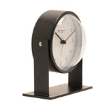 Round Adjustable Metal Alarm Clock 13.5cm in black and white, with a round white dial in a matt black case held by pivoting arms on a flat rectangular base, shown on a plain white background.