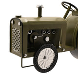 Green tractor mantel clock close-up showing the bonnet, exhaust stack, front grille, open engine bay with bolts, and front wheel detail on a white background.