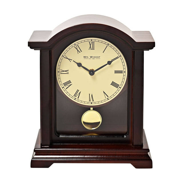 Dark walnut finish broken arch mantel clock with cream Roman numeral dial, black hands, gold-coloured pendulum, and moulded base, shown on a plain white background.