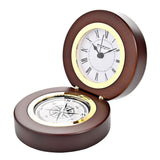 Round walnut finish folding mantel clock, open on its hinge with a white Roman numeral dial in a gold-tone bezel above a compass rose base, shown on a white background.