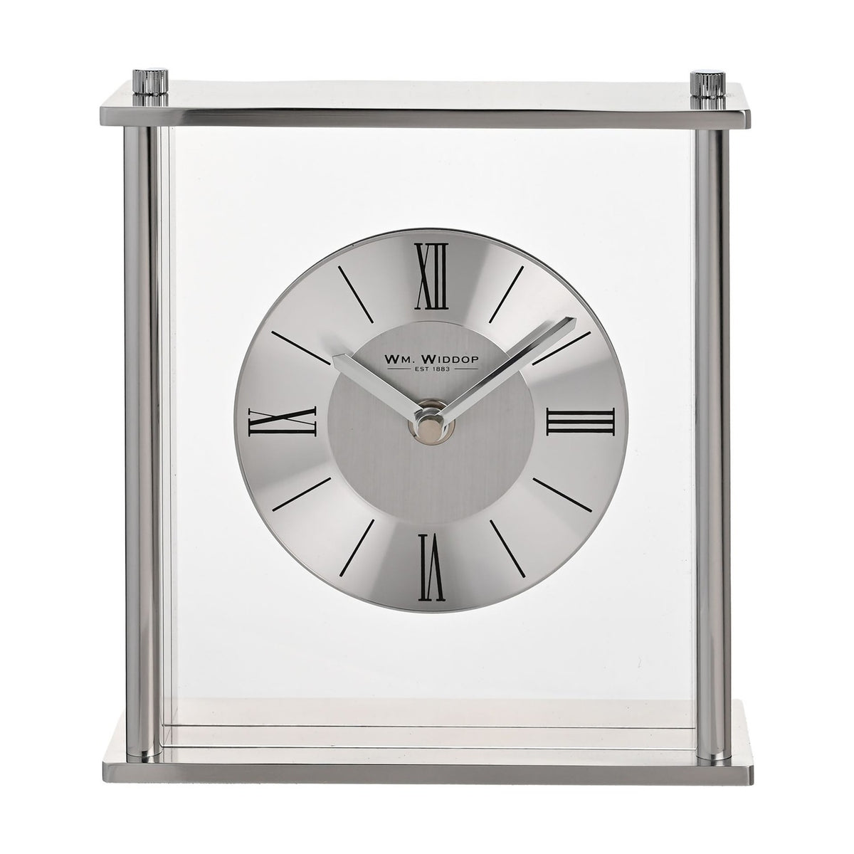 Square silver mantel clock with clear glass panels, four pillar supports, and a round two-tone dial featuring black Roman numerals, set against a plain white background.