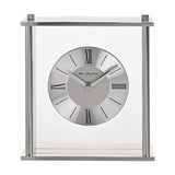 Square silver mantel clock with clear glass panels, four pillar supports, and a round two-tone dial featuring black Roman numerals, set against a plain white background.