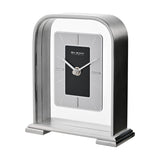 Arched portrait mantel clock in silver metallic finish with a rectangular black centre dial, silver-grey surround, baton markers, and silver hands, set on a plain background.