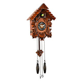 Pitched Roof Quartz Wooden Cuckoo Wall Clock in mahogany, with carved leaves, a black Roman numeral dial, bird detail under the roof, and hanging pinecone-style weights on chains.