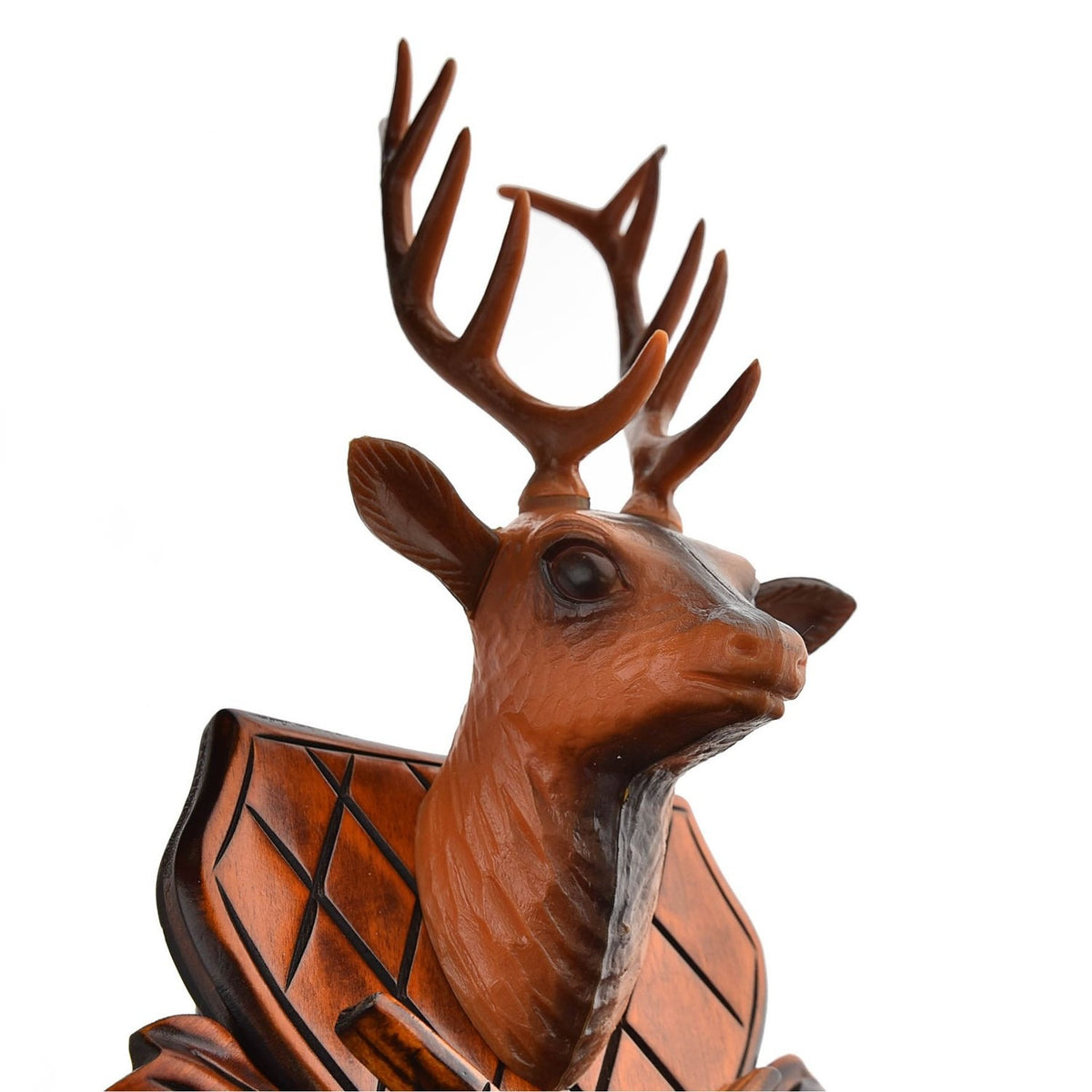 Close-up of the carved stag's head and antlers on the Stag Wooden Quartz Cuckoo Wall Clock, showing mahogany wood with a matt finish and diamond-patterned shield detailing.
