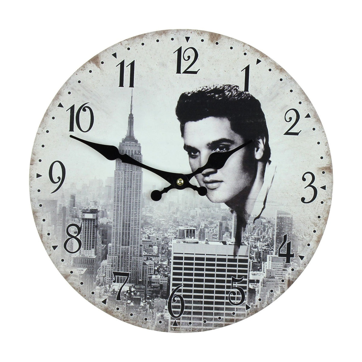 Round wall clock, 29.8cm, white dial with bold black Arabic numerals, featuring a black and white New York skyline and a quiffed young man's portrait, black hands, on a plain white background.