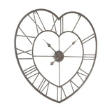 Open heart metal wall clock in silver, with Roman numerals set between an outer and inner heart outline and slim hands on a round centre boss, shown on a white background.