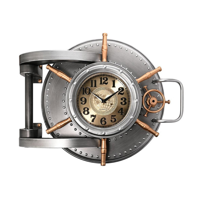 Riveted Safe Door Wall Clock in silver finish with copper-toned spoked wheel, hinge and loop handle, cream and gold dial with black numerals, on a plain white background.