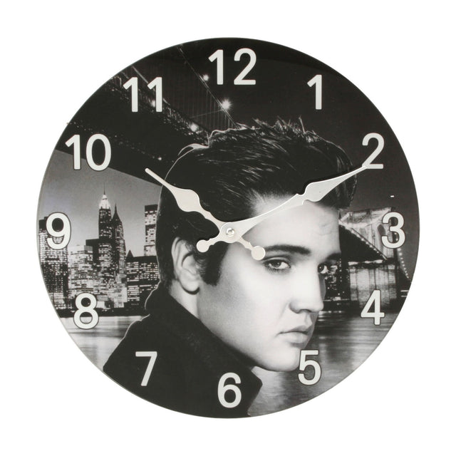 Round glass wall clock, 33cm, with a black and white portrait print of a man against a night city skyline and bridge, bold white Arabic numerals and white hands.