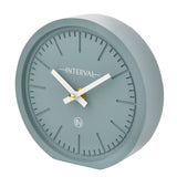 Round matt teal mantel clock, 15.4cm, with baton hour markers, white hands, gold-tone centre, and "Interval" text on the dial, shown on a white background.