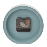 Rear view of the Minimalist Round Matt Desk and Mantel Clock in teal, showing the exposed quartz movement mechanism within the round case, set on a plain white background.