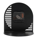 Rear view of the Cut Out Steel Mantel Clock in black, showing the exposed clock movement mechanism, cut-out slot pattern, and curved base on a plain white background.