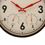 Close-up of the Vintage Wall Clock with Weather Station 33cm, showing red hands, black numerals, and built-in temperature and humidity dials on a cream face with copper-tone ring and black case.