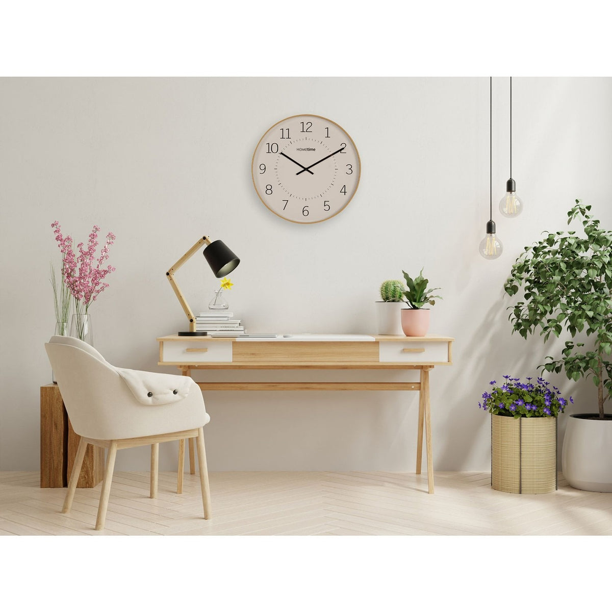 Round Numeral Dial Quartz Wall Clock, 50.5cm, with a beige and white face, black numerals, and light wooden frame, mounted above a desk in a home workspace.