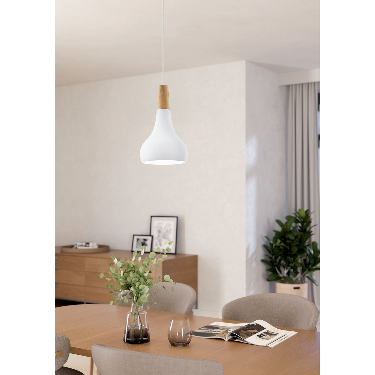 Walette Wooden Pendant Light 18cm in white steel with a wood collar, teardrop shade hanging above a wooden dining table in a living room setting.