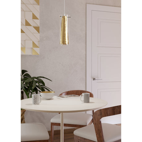 Wasmelle Glass Pendant Light in Black, a slim clear glass cylinder with tapered gold inner cone on black flex, hung above a round dining table in a neutral-toned dining room.