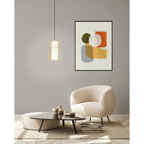Wasvine Glass Pendant Light in Gold, hourglass-shaped wire cage with white opal glass cylinder, hung above a living room seating area.