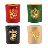 Set of 4 round glass tealight candle holders in red, green, black and cream with gold Harry Potter house crests for Gryffindor, Slytherin, Ravenclaw and Hufflepuff, shown on a white background.