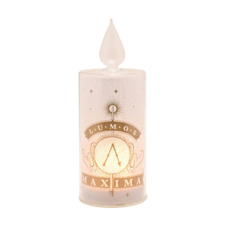 Harry Potter Lumos Maxima LED glass pillar candle, 22cm, with clear teardrop flame top and gold Lumos Maxima wand design, shown lit on a plain white background.