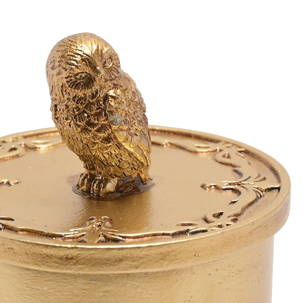 Round Hedwig trinket box with gold metallic finish, lift-off lid topped by a detailed owl figure, shown against a plain white background.
