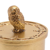 Round Hedwig trinket box with gold metallic finish, lift-off lid topped by a detailed owl figure, shown against a plain white background.