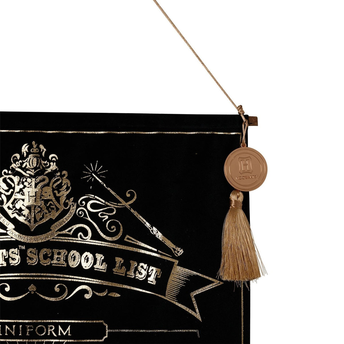 Harry Potter School List hanging wall banner in black velvet with gold foil Hogwarts crest and wand design, hung by cord with a round medallion seal and tassel detail.