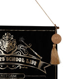 Harry Potter School List hanging wall banner in black velvet with gold foil Hogwarts crest and wand design, hung by cord with a round medallion seal and tassel detail.
