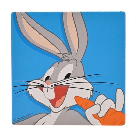Square ceramic coaster featuring Bugs Bunny grinning with a carrot, grey ears and whiskers, set against a vivid blue background with rounded corners.