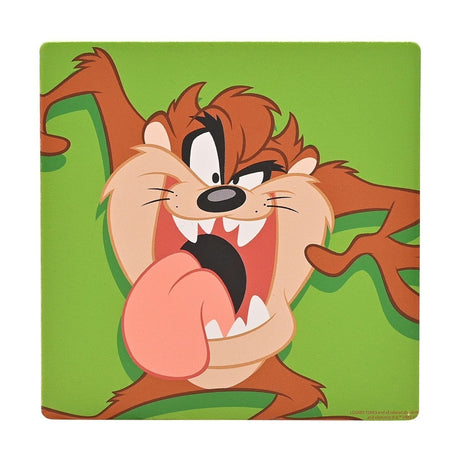 Square ceramic coaster featuring the Tasmanian Devil mid-spin with a wide toothy grin and tongue out, illustrated in brown and tan against a bold green background.