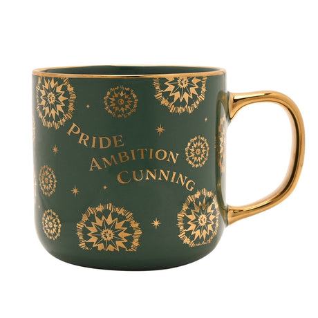 Green porcelain mug with gold handle, featuring gold sunburst motifs and "PRIDE AMBITION CUNNING" lettering, from the Slytherin House design, shown on a white background.