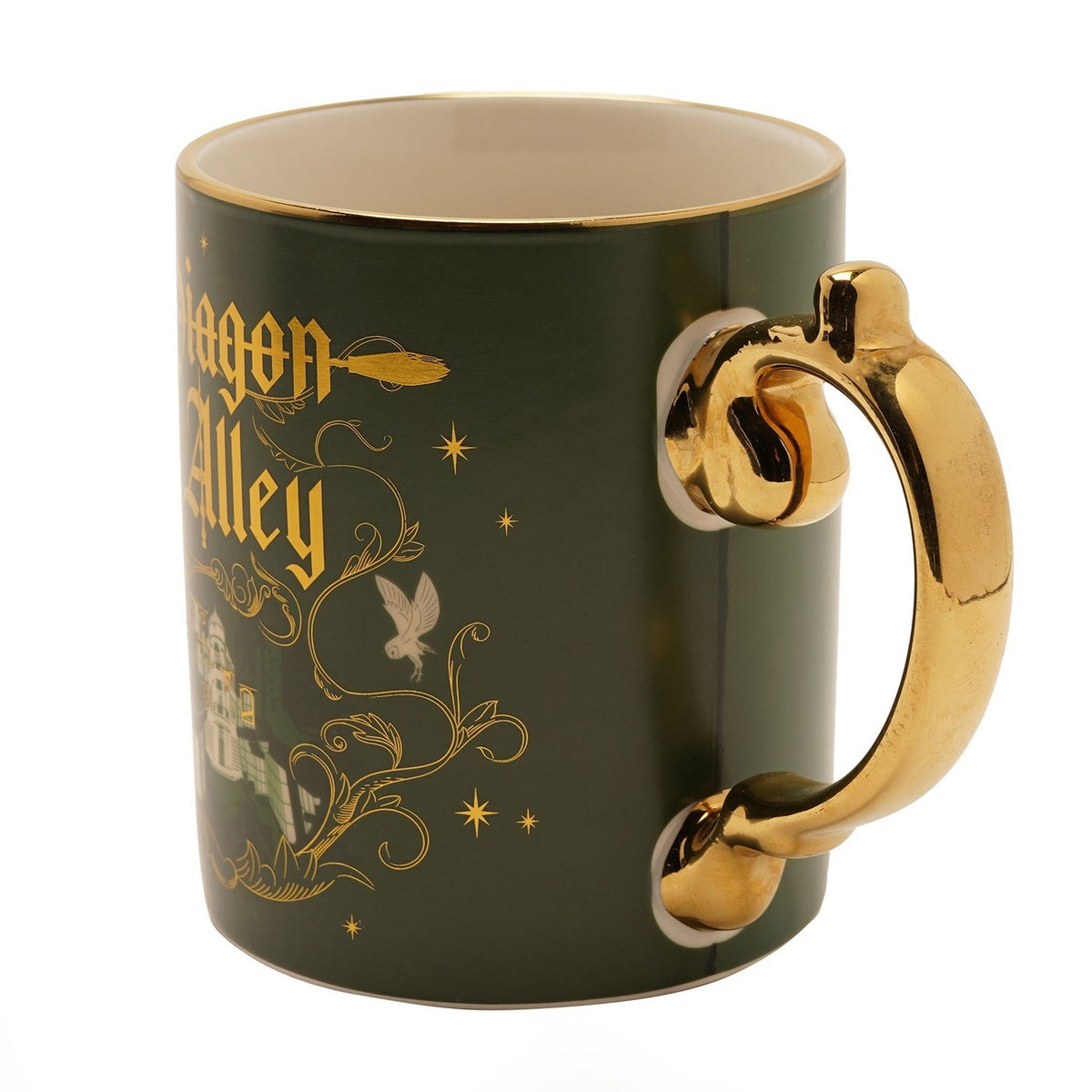 Porcelain mug in matt green with gold rim and gold handle, featuring "Diagon Alley" in gold Gothic script, owls, stars, and shopfront artwork, shown on a white background.