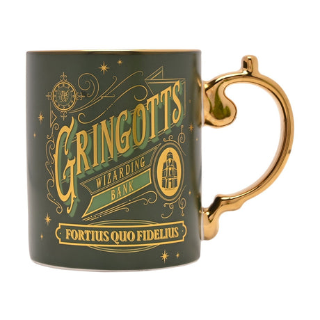 Porcelain mug in green and gold featuring "Gringotts Wizarding Bank" lettering, an oval bank emblem, and the motto "Fortius Quo Fidelius," with a gold handle, on a plain white background.