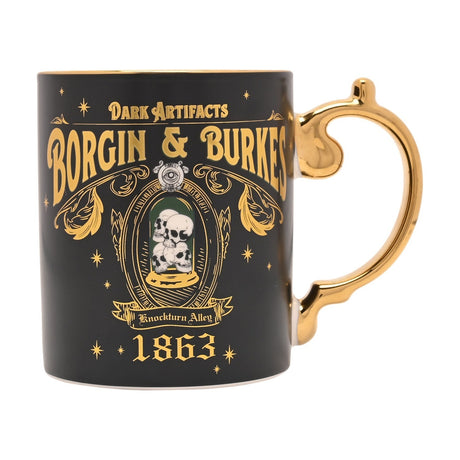 Black ceramic Harry Potter Borgin & Burkes mug with gold handle, featuring "Dark Artifacts," shopfront lettering, a skull emblem, "Knockturn Alley" banner and 1863 date, on a white background.