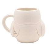 White glossy stoneware mug shaped as Hedwig the owl, with sculpted wings, dark eyes, a small beak, and a raised letter on her chest, set against a plain white background.