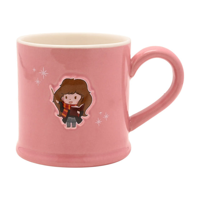 Pink stoneware mug with an embossed cartoon Hermione Granger holding a wand and open book, surrounded by small white sparkles, on a plain white background.