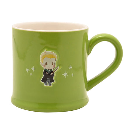 Green stoneware mug with a glossy finish and cream interior, featuring an embossed Draco figure in cartoon style with robe, tie and wand, surrounded by white star accents, on a plain background.