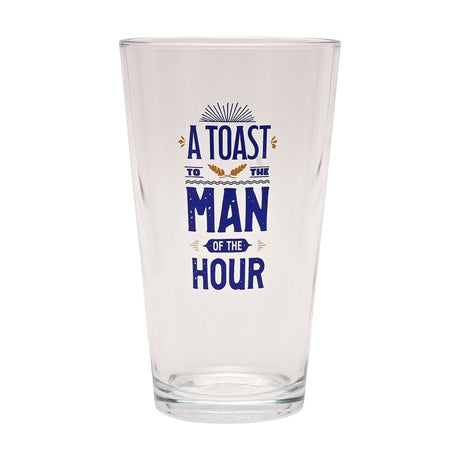Clear tapered pint beer glass, 460ml, with bold blue "A Toast To The Man of The Hour" text and gold sprig accents, shown on a plain white background.