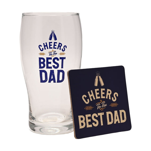Clear pint beer glass and matching navy blue coaster printed with "Cheers To The Best Dad" and a clinking bottles motif, shown on a white background.