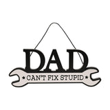 Wooden spanner-shaped wall plaque with bold black "DAD" lettering and white handle reading "Can't Fix Stupid" in black text, hung with cord on a plain white background.