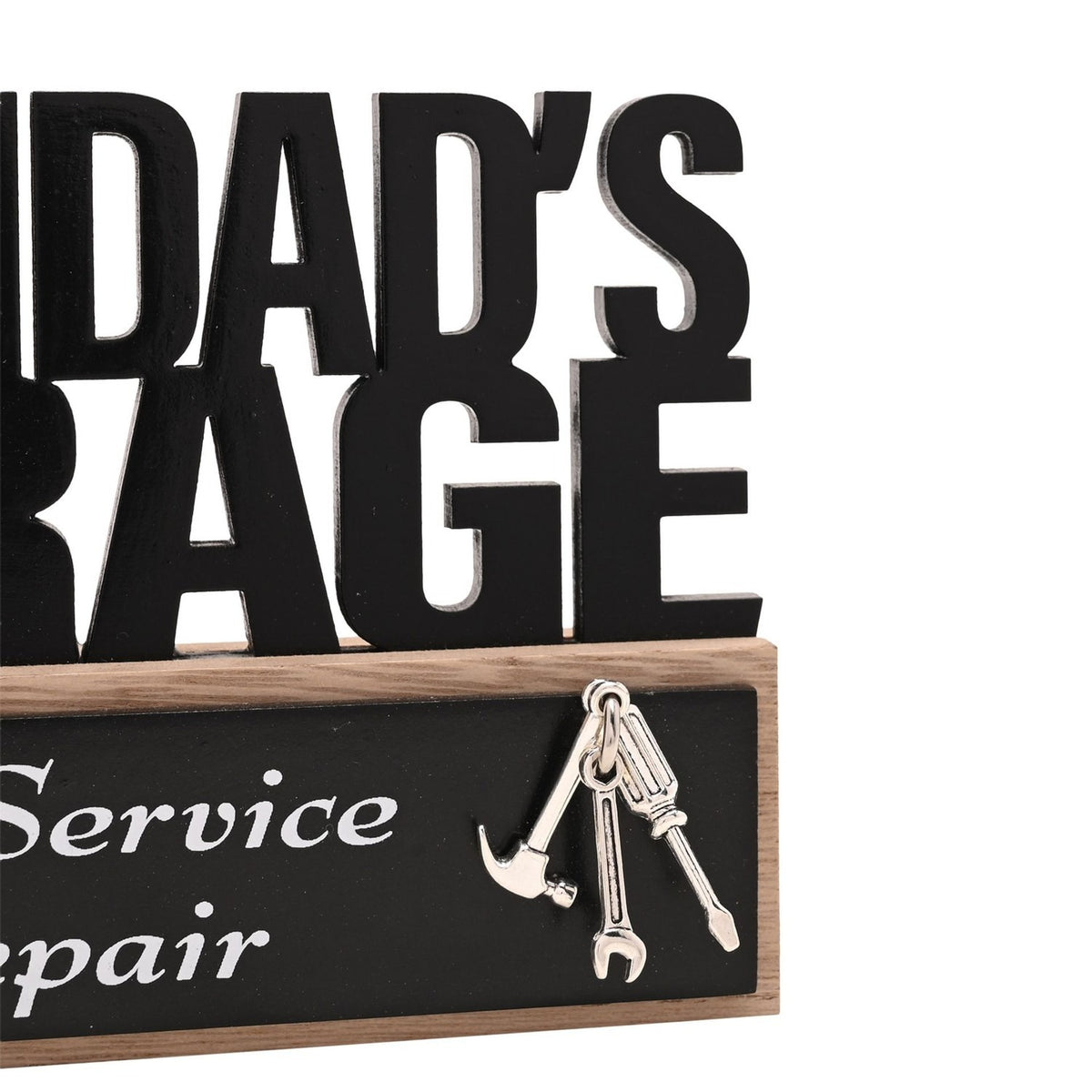 Close-up of a wooden Grandad's Garage plaque with bold black cut-out lettering, a black panel reading Quality Service and Repair, and a silver hammer, spanner and screwdriver charm.