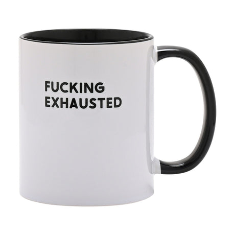 White ceramic mug with black interior and handle, printed "FUCKING EXHAUSTED" in bold black capitals on the white body, shown against a plain white background.
