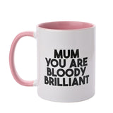 White stoneware mug with pink interior and handle, printed with "MUM YOU ARE BLOODY BRILLIANT" in bold black text, 11oz, on a plain white background.