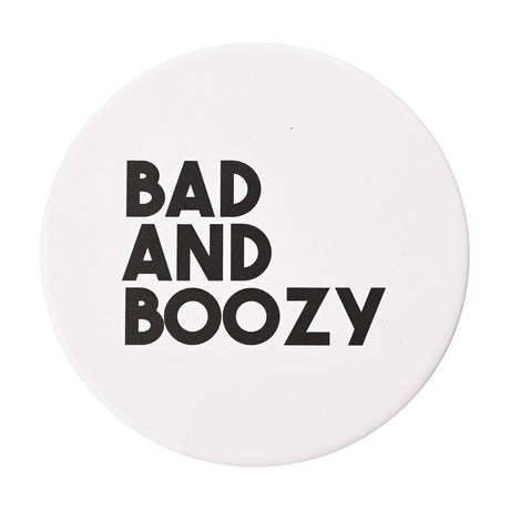 Round white matt ceramic coaster printed with "BAD AND BOOZY" in bold black capital letters, shown on a plain white background.